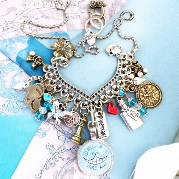We’re all mad here necklace featuring Alice in Wonderland necklace. 21” long